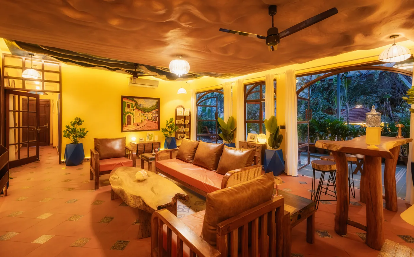 Warm living lounge with sofas and a dining table