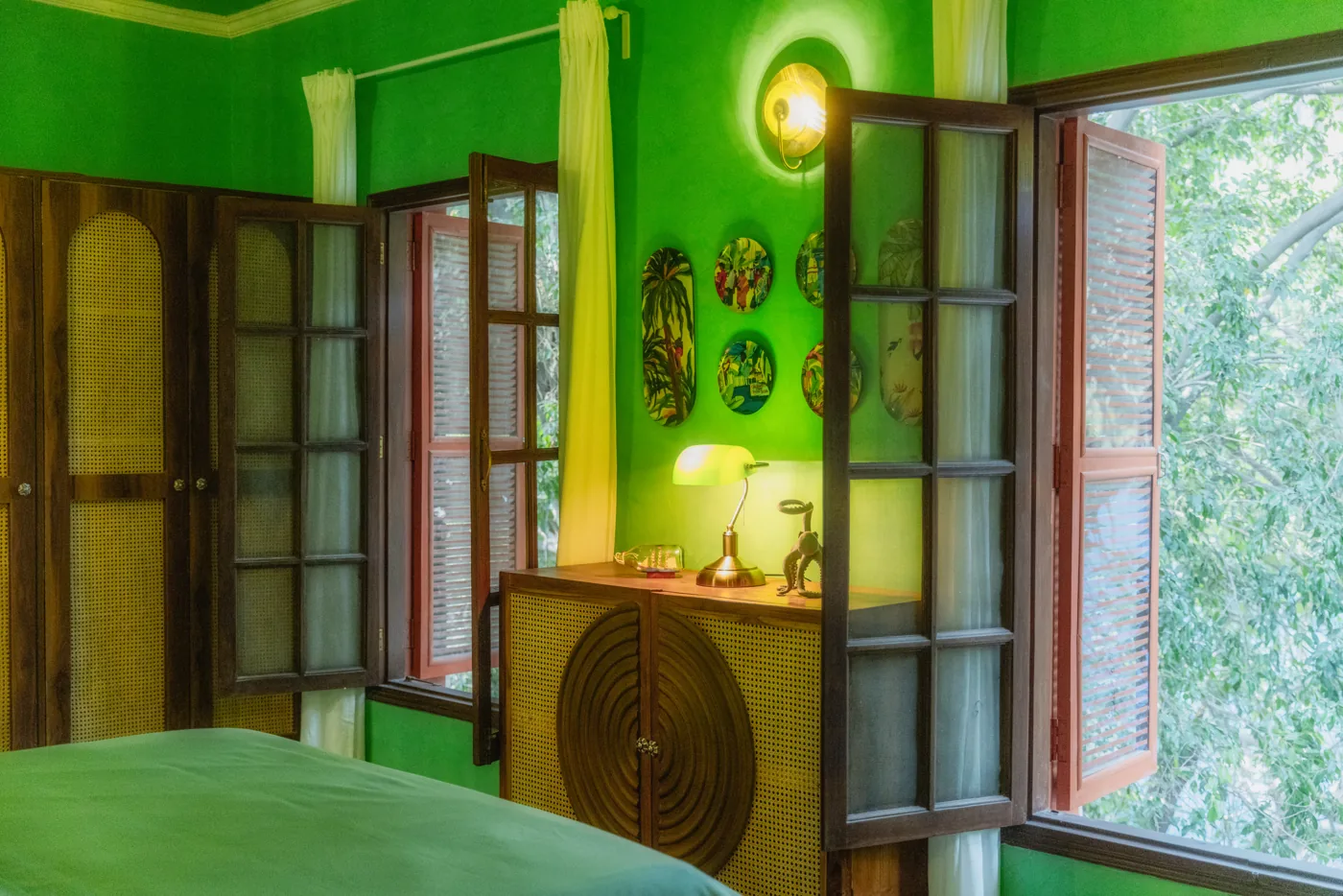 Bright green room with tall windows